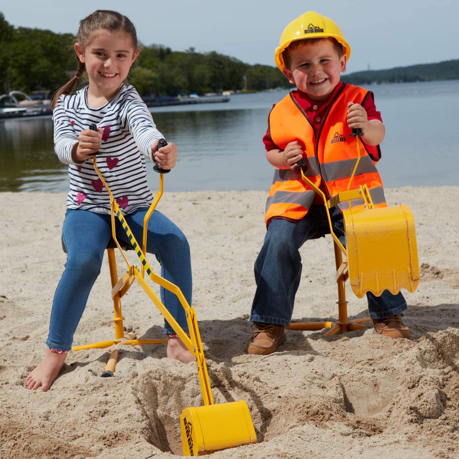 Two kids playing with sand diggers